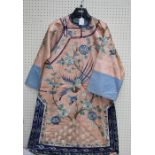 A late 19th/20th century Chinese lady's silk coat, woven in shades of turquoise and blue with bird i