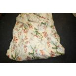 A large ivory ground floral chintz lined curtain, 510cm wide x 298cm drop, together with smaller mat