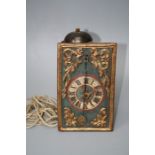 An 18th century Swiss or Austrian carved, painted and gilt 30 hour wall clock with simple wooden pla