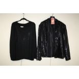 Calvin Klein. A sparkly black long sleeve jacket together with a sparkly black jumper Formally the p