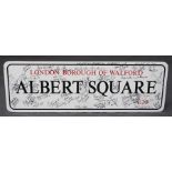 A signed East Enders E20 Albert Square promotional street sign. With many signatures of cast and cre