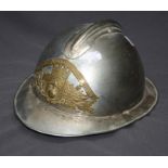 A French (1933 Pattern) nickel plated fireman's helmet with pierced and embossed front plate