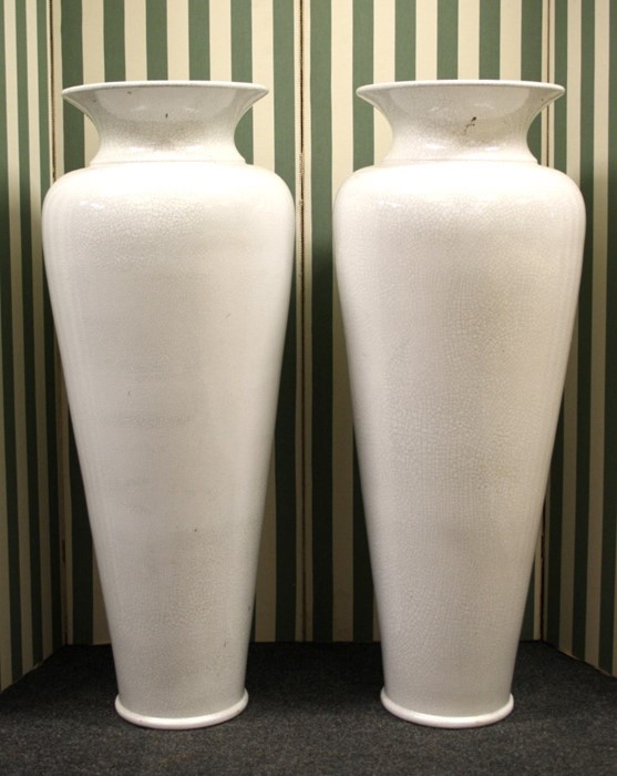 A very large pair of baluster form cracked glaze white pottery vases. 103cm high Formally the prope