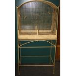 A large vintage painted parrot cage with arched top and decorative stand, 78cm wide