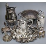 A collection of silver plated items including trophy cups, ice water jug, Sheffield plate desk stand