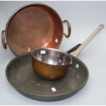A circular copper two handled cooking pan, together with a large copper frying pan and other copper