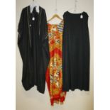 A Junonia sleeveless black dress together with one other and a Nadia Kemp gold cape Formally the pro