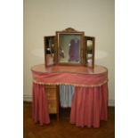 A vintage upholstered kidney shaped dressing table, 107cm