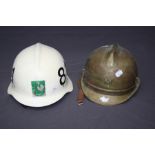 A Bulgarian (Soviet Era) brass fireman's helmet with star insignia, together with a Swedish Brissman