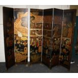 A 20th century Chinese black lacquer six fold room screen. Decorated with Chinoiserie scenes. 240cm