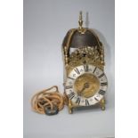 A 17th century style thirty hour lantern clock with large cast bell, silvered chapter ring and singl