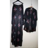 Sheila Fersht Couture, a long sleeve embroidered cape, black and floral design together with another