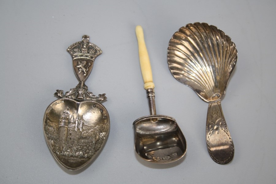 A George III silver caddy spoon with shell bowl and bright cut handle, London 1793, together with a