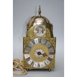 A part 18th century thirty hour alarm, lantern timepiece with verse escapement and later "rocking su