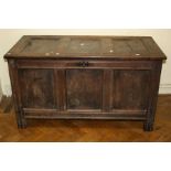 A late 17th century oak three panel coffer, with plain panels and stile feet, 124cm long