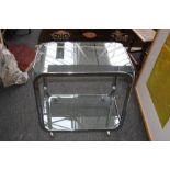 A 20th century chrome plated and plate glass cocktail trolley. 73cm wide Formally the property of t