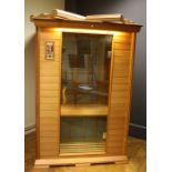 An electric "Sunlight" Sauners in-home sauna with integral sound system. 134cm wide Formally the pr