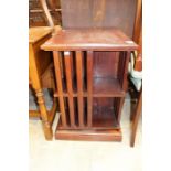 An Edwardian style mahogany swivelling bookcase, square form, 72cm high, 49cm wide.