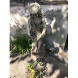 Garden statuary, a stone figure of a girl