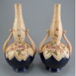 A pair of late nineteenth two-handled vases, by Thomas Forrester, c. 1895. Each is decorated with