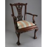 A small-size Chippendale-style child's chair with upholstered seat, ideal for displaying a doll or