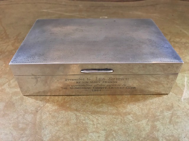 A George VI silver table cigarette casket of cricket interest, inscription presented to Les