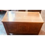 A 20th century light oak three panel coffer, in a 17th Century manner, rectangular top above three