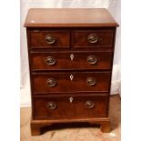 A George IV revival mahogany chest of drawers, a moulded edge top, two short and three long