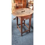 An early 20th Century oak stool/stand, oval top raised on square supports and stretchers. 60cm