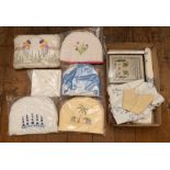 A collection of tea cosies to include: one with two embroidered elephants, one with yellow & gold
