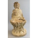 A composition bird bath in the form of an infant wearing a nightdress, height 50cm