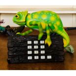 A 20th Century Chameleon and ladybird telephone.