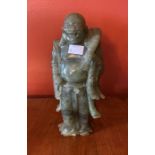 A Chinese bowenite soapstone figure of Hotei. 27cm H