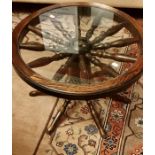 A 20th Century oak ship helm circular occasional table, constructed with from one helm on a