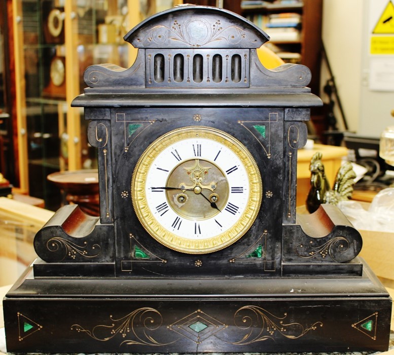 A French 19th Century slate eight day mantel clock, inset with malachite, the face with a white