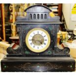 A French 19th Century slate eight day mantel clock, inset with malachite, the face with a white