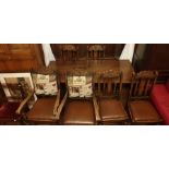 A 17th century revival oak trestle table, rectangular top on turned globe supports united with