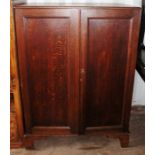 A 19th Century oak linen cabinet, converted into a television cabinet