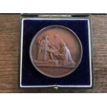 A cased early 20th Century Joseph Moore of Birmingham bronze gymnastic medal