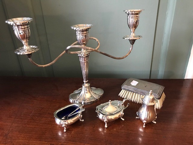 An Elizabeth II silver weighted silver triple branch candelabrum, Birmingham 1968, together with a