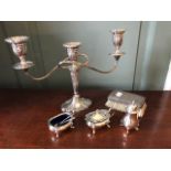 An Elizabeth II silver weighted silver triple branch candelabrum, Birmingham 1968, together with a