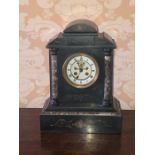 An early 20th Century ebonised marble mantel clock, 8-day movement striking to a bell with roman