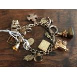 A 9ct gold charm bracelet, approximate weight all in 38 grams