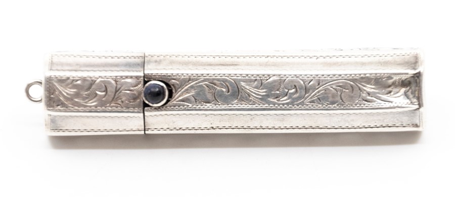 An early 20th Century silver lipstick tube, bright cut engraved, sapphire cabochon button