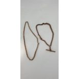 A 9ct rose gold graduated curb link 'Albert' watch chain and a yellow gold curb link necklace, total