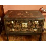 An oriental black lacquer cabinet on stand, double front doors