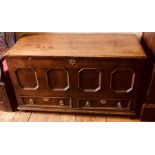 A George III oak mule chest, circa 1780, rectangular lid on a four panel octagonal moulded front,
