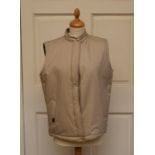 A Daks Gilet size 10 sample (new) beige with a checked lining, zip and slit pockets and a Daks