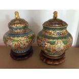 A pair of recent cloisonne covered bombe vases on wooden stands (2)