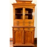 A Victorian display cabinet on dresser, moulded scrolled top on a moulded pediment, above a glazed